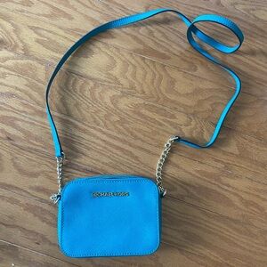 Michael Kors teal mini crossbody purse.